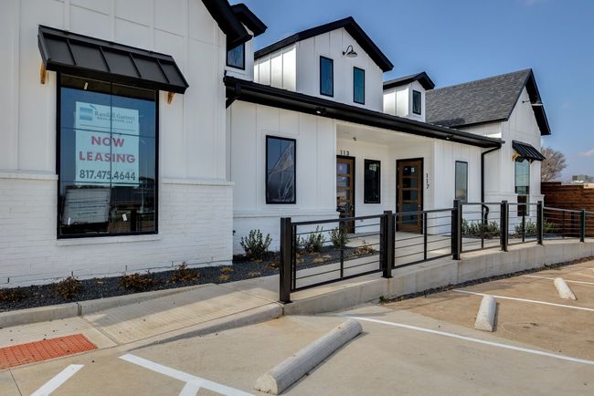 View of property featuring uncovered parking | Image 23