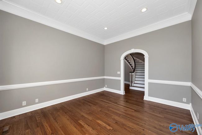Wood flooring, crown molding, chair railing, recessed lighting | Image 23