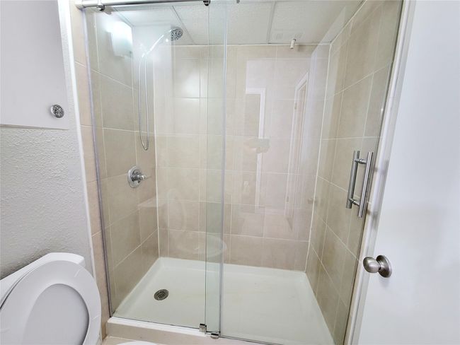 Bathroom featuring toilet and walk in shower | Image 15