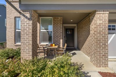 Covered Porch w Room for morning coffee, keeping an eye on the kids, or interacting with neighbors. | Image 2