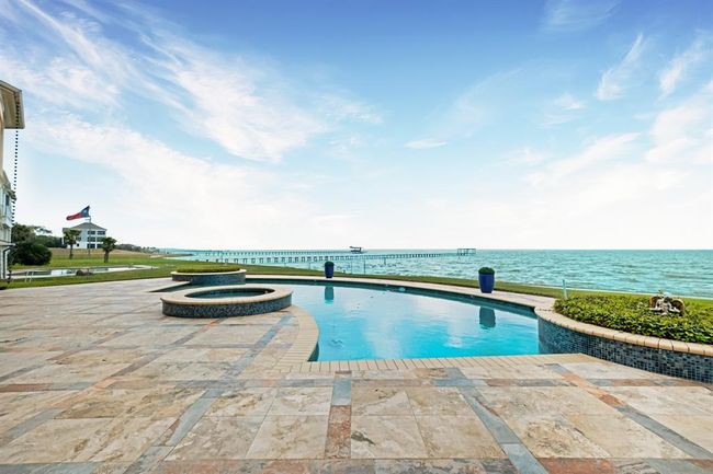 Enjoy this beautiful pool and hot tub with unobstructed views of Galveston Bay. | Image 5