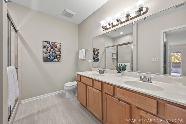 Dual sinks and new tile floor. | Image 13