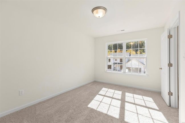 View of carpeted spare room | Image 5