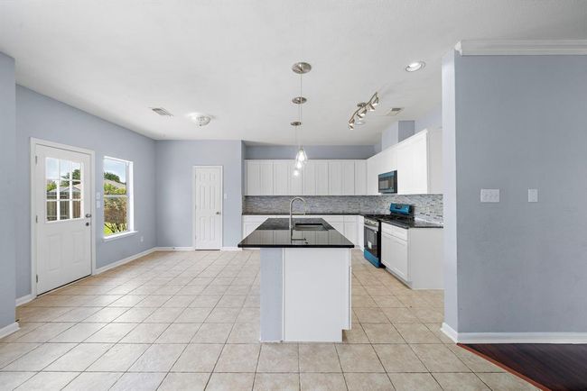 Homeowner did not remove the protective coverings from new appliances. They are stainless steel appliances. | Image 11