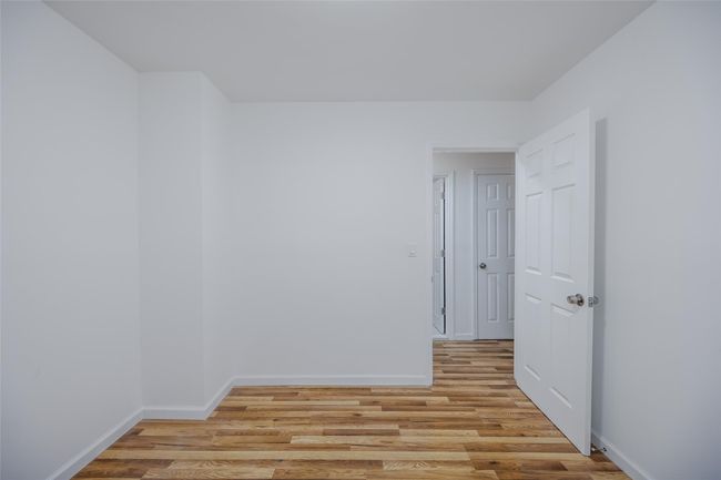 Full bathroom featuring tile walls, tiled shower / bath combo, vanity, and toilet | Image 23