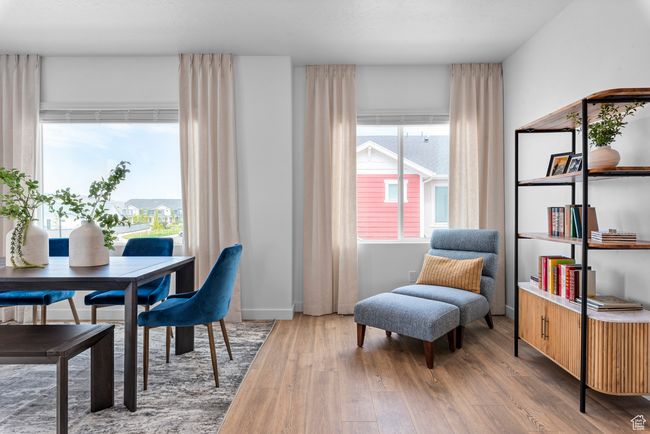 Dining room with wood finished floors | Image 10
