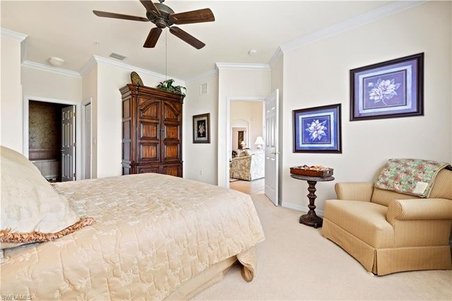 Bedroom with crown molding, baseboards, carpet, and visible vents | Image 19
