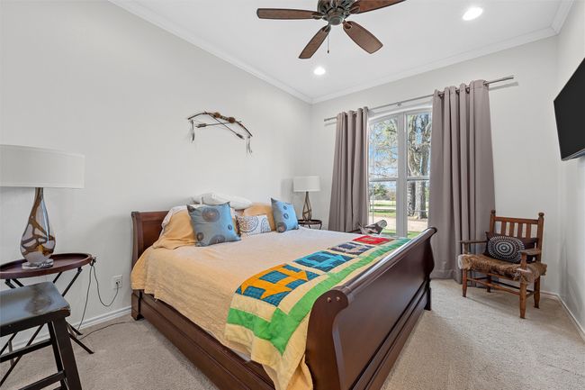 Bedroom featuring light carpet, crown molding, recessed lighting, and ceiling fan | Image 14