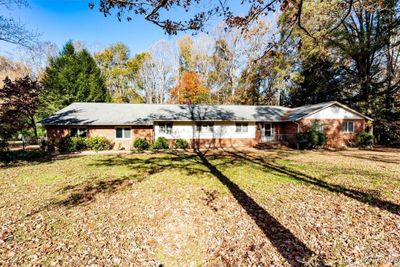 Front of home featuring a front yard | Image 1