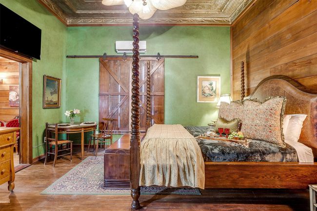 Keaton's Lodge features a California King four post bed, handmade shutters from reclaimed vintage 1x12 wooden planks | Image 25