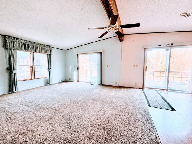 side by side of the patio doors leading to the deck | Image 8