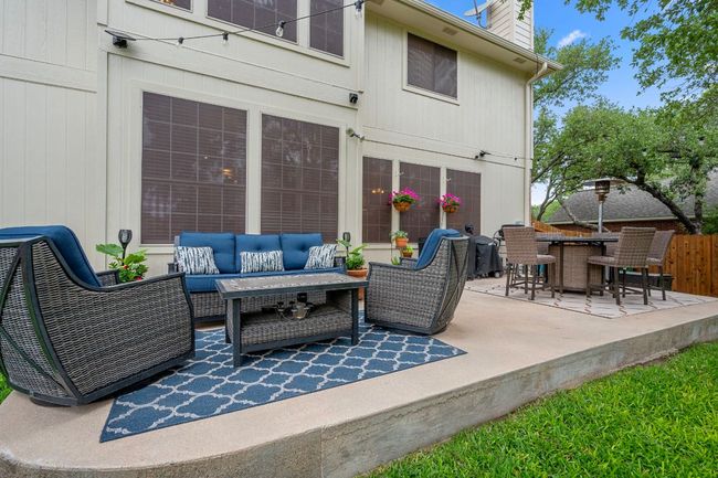 The large back patio is the perfect place to relax with privacy | Image 30