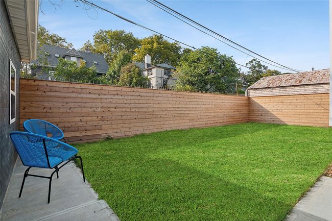 View of fenced backyard | Image 10