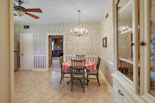 The kitchen also has built ins, a signature of this age home. | Image 14
