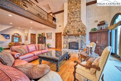 Massive stone fireplace serves as centerpiece for great room. | Image 3