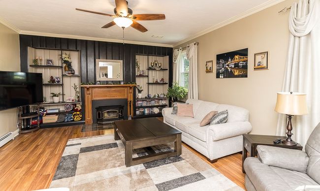 the gorgeous handmade mantle is the focal point in this room | Image 29