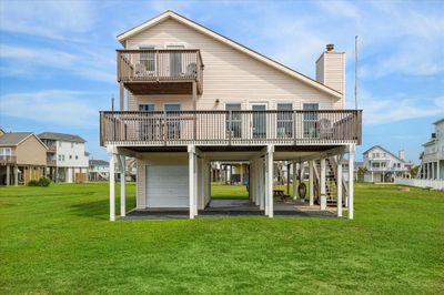 Looking for a quiet cottage as close to the beach as you can get under $500k? Look at this charming 3/2 one-story cottage with amazing Gulf views from a large balcony or private balcony on the second floor facing the beach! | Image 1