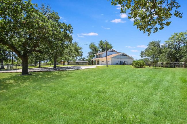 View of yard with a garage and driveway | Image 27
