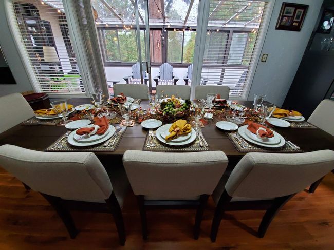Dining area with wood finished floors and a healthy amount of sunlight | Image 8