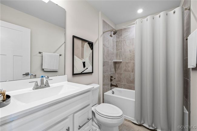 Full bath with shower / bath combination with curtain, toilet, vanity, and recessed lighting | Image 12