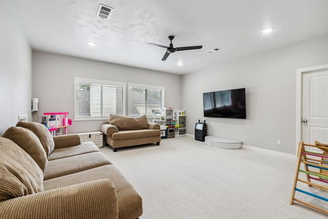 This expansive game room is designed for fun and comfort, offering abundant space and the added benefit of two Texas basements. | Image 28
