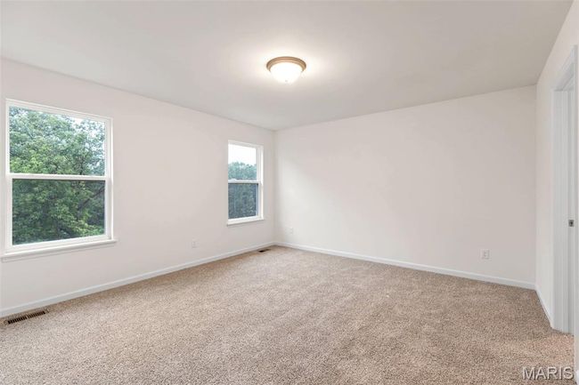 Spare room featuring light colored carpet | Image 14