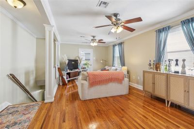 Upper Unit living area with original hardwood flooring | Image 3