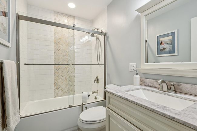 Full bathroom with vanity, shower / bath combination with glass door, and recessed lighting | Image 17