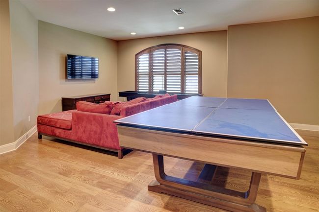 Upstairs Living Area is set up as a game room and has a very large walk-in closet with shelves to store games or just used as extra storage. | Image 33