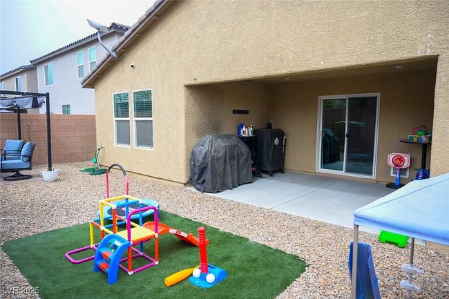 Back of house featuring fence, a patio area, and stucco siding | Image 29
