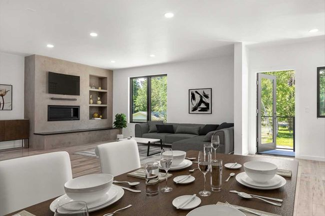 Great room Virtually furnished, west facing with access to small deck. | Image 8
