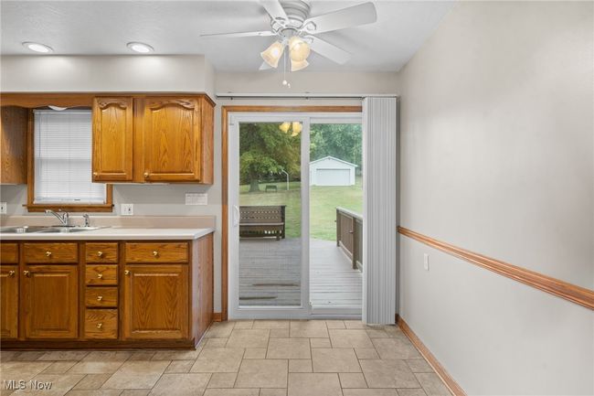 Kitchen featuring sink and ceiling fan | Image 11