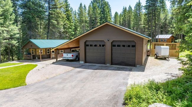Shop/Garage with tall doors and attached carport. Electricity and Water! | Image 24