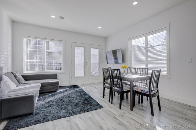 Dining space with french doors, light wood finished floors, and recessed lighting | Image 6