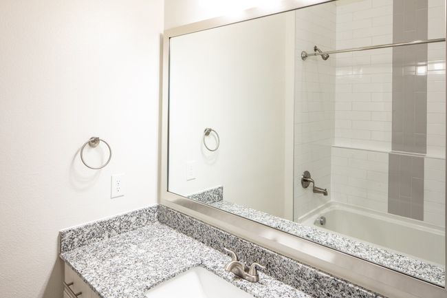 Bathroom with vanity and tiled shower / bath combo | Image 9