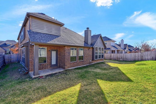 A large, yet manageable yard with a welcoming covered patio. | Image 29