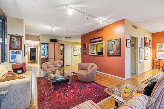 This angle showcases the thoughtful layout, with the kitchen centrally located and seamlessly connected to the dining and living areas. | Image 6
