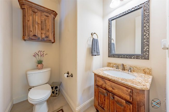 Bathroom with tile flooring, oversized vanity, and toilet | Image 26