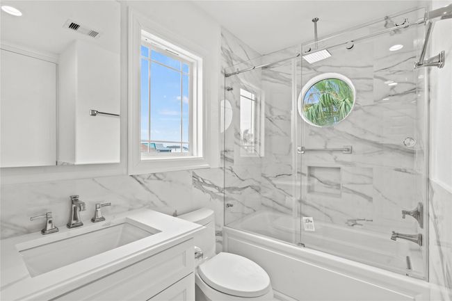 Secondary bathroom on main floor. This tile is really beauthiful! | Image 15