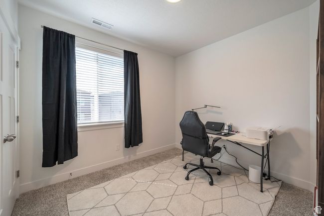 Office featuring light colored carpet, baseboards, a healthy amount of sunlight, and visible vents | Image 9