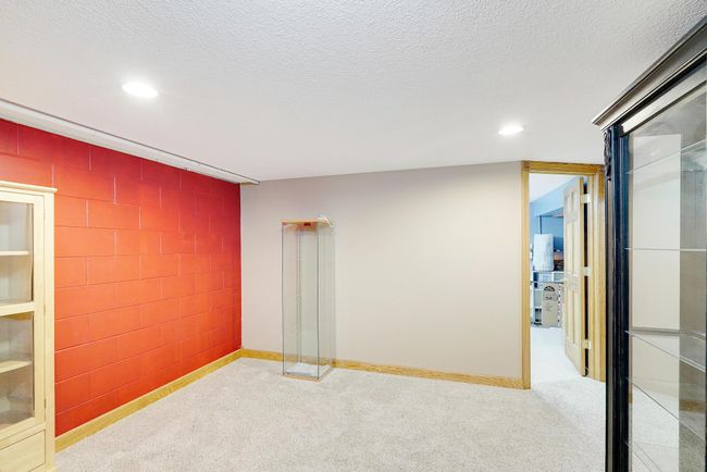 This storage space in lower level could be modified to create a lower level mother-in-law suite. | Image 34