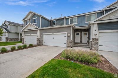 7425 N Hutch Ln, Townhouse with 3 bedrooms, 2 bathrooms and 4 parking in Eagle Mountain UT | Image 1