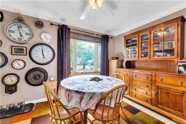 Dining area with ceiling fan and baseboards | Image 11