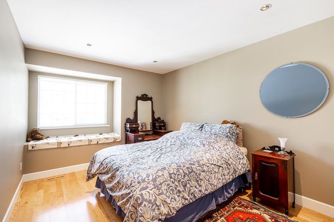Bedroom with wood finished floors and recessed lighting | Image 22