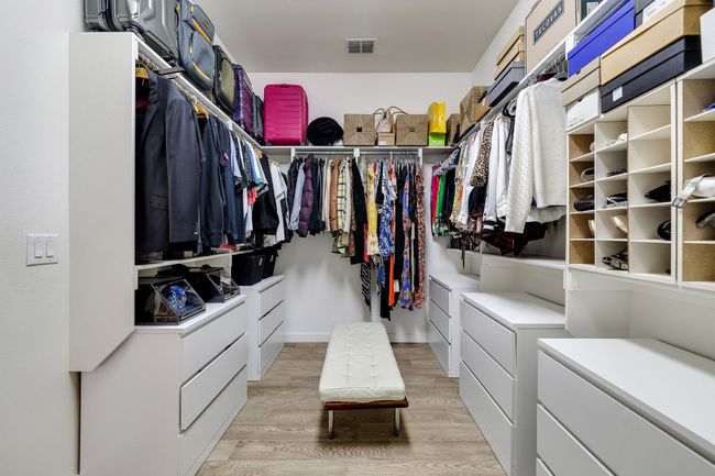 Walk in closet featuring light wood-style flooring | Image 25