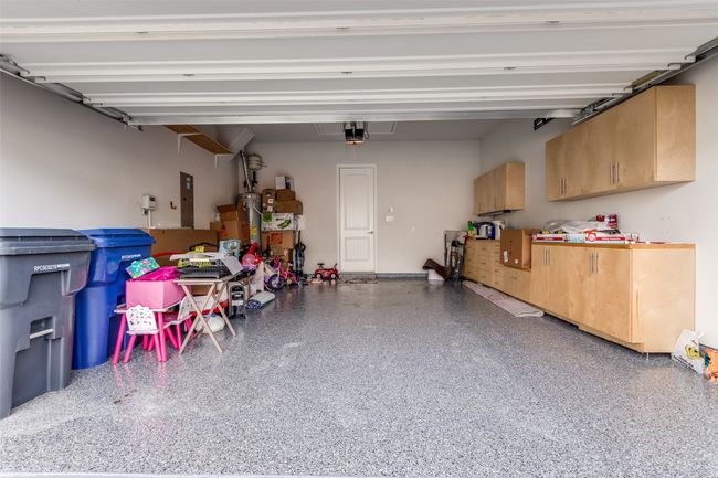 Garage with electric panel and a garage door opener | Image 23