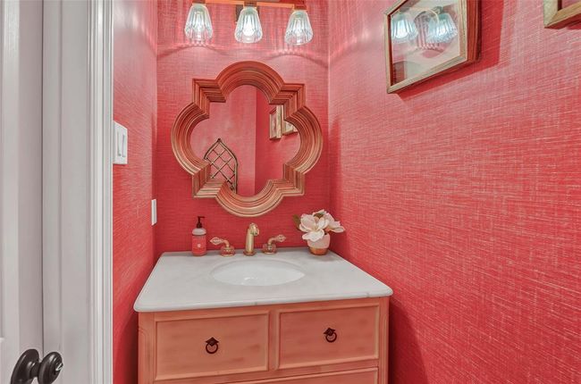 Darling powder bath with red linen wallpaper. | Image 17