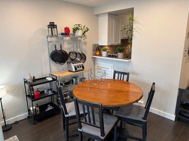 Dining space featuring baseboards and dark wood-style floors | Image 6