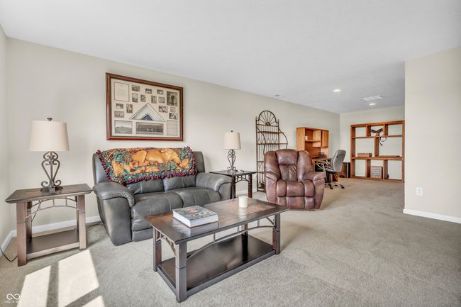 carpeted bonus room w/mechanical room at end and full bath near top of stairs | Image 39