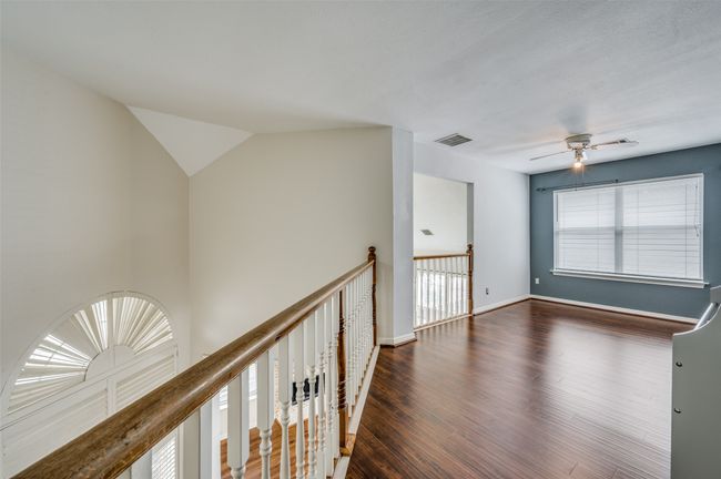 Corridor with wood finished floors and baseboards | Image 11